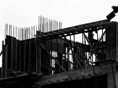 How Small Teams Can Use the NIST AI Risk Management Framework to Stay Ahead of AI Risk Illustration of a small team collaborating on AI risk assessment for sustainable building design using NIST framework guidelines